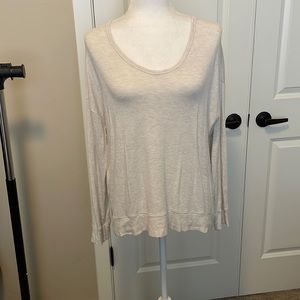 Cream long sleeve shirt.